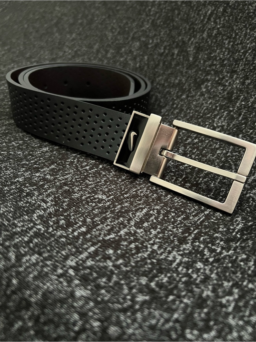 Nike Black Perforated Men's Belt with Silver Buckle and Swoosh Accent